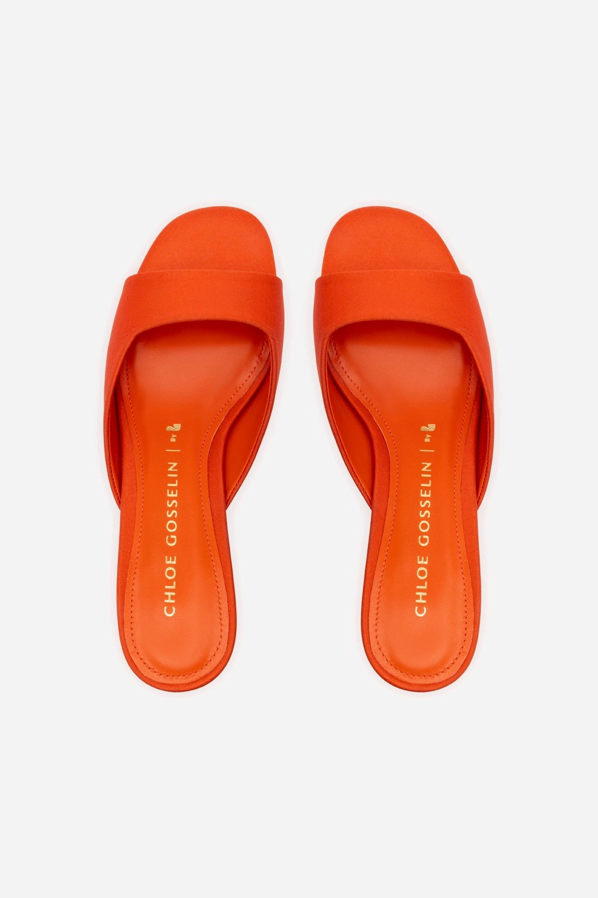 Chloe Gosselin by Larroudé Anah Mule In Orange Sunrise Satin