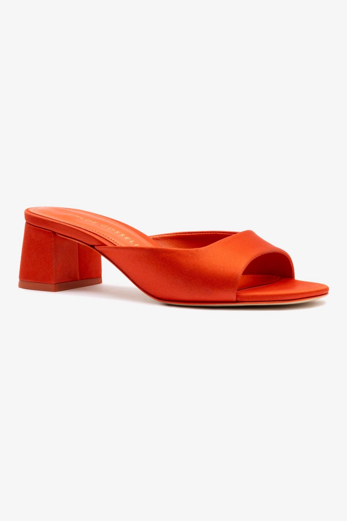 Chloe Gosselin by Larroudé Anah Mule In Orange Sunrise Satin