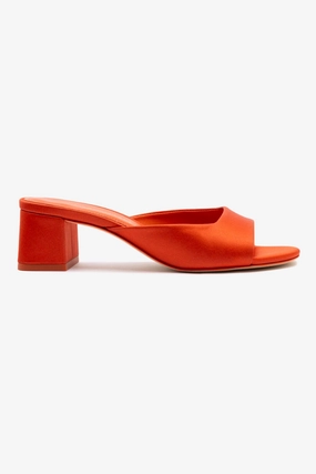 Chloe Gosselin by Larroudé Anah Mule In Orange Sunrise Satin