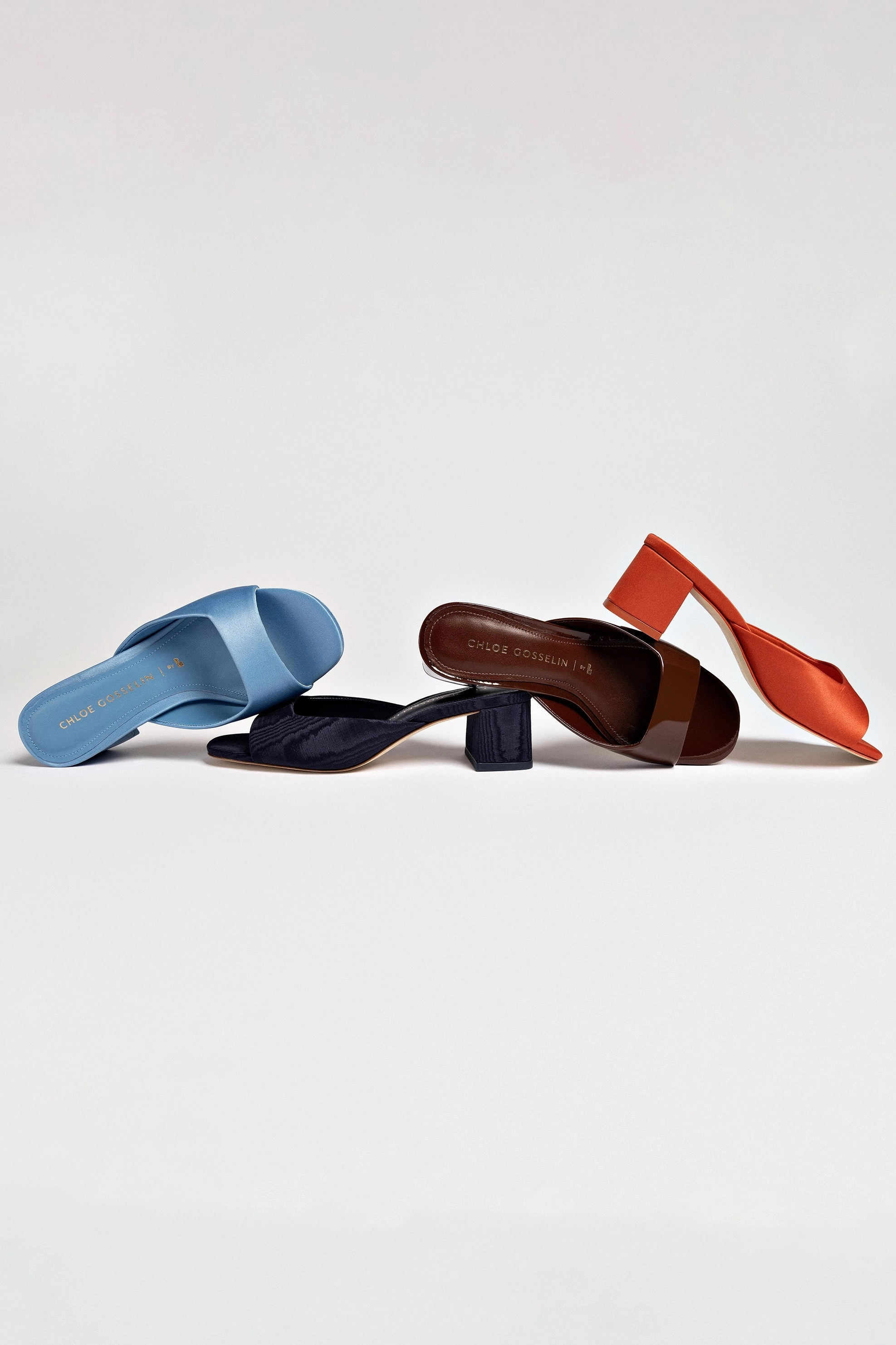 Chloe Gosselin by Larroudé Anah Mule In Orange Sunrise Satin